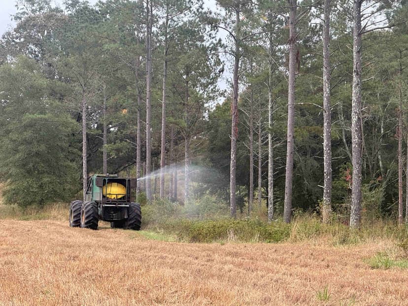 Forestry skidder spraying herbicide during chemical site preparation